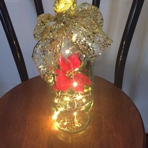 Red poinsettia wine bottle lantern